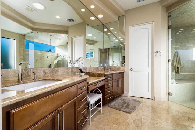 bathroom with vanity and a shower with door