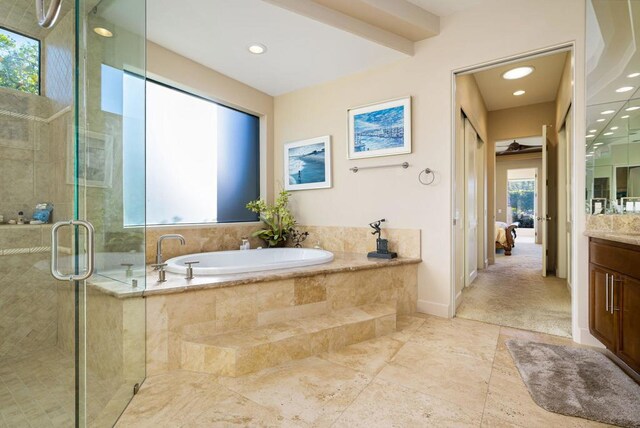 bathroom featuring vanity and plus walk in shower