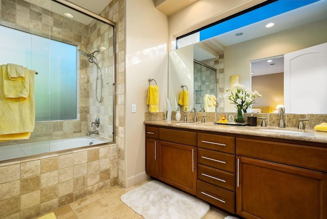 bathroom with vanity and shower / bath combination with glass door