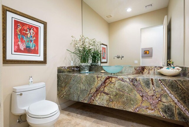 bathroom with vanity and toilet