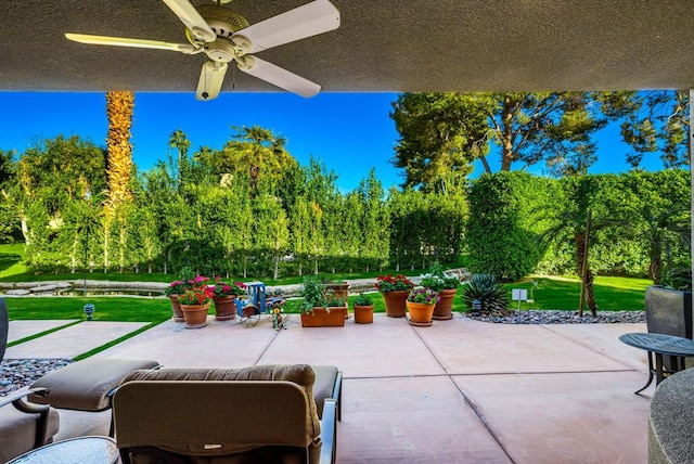 view of patio featuring ceiling fan