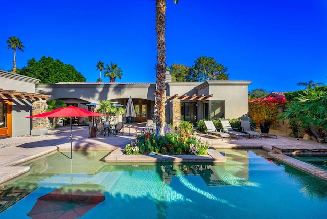 back of house featuring a pergola and a patio