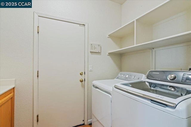 clothes washing area with separate washer and dryer