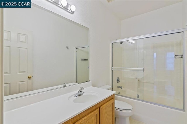 full bathroom with bath / shower combo with glass door, vanity, and toilet