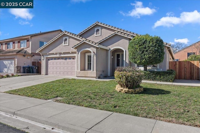 view of front of home featuring a garage and a front lawn