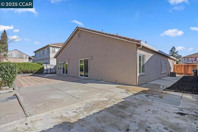 back of house with a patio