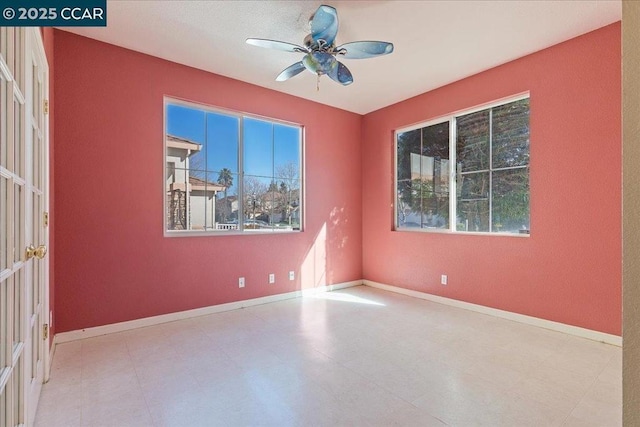 unfurnished room with ceiling fan