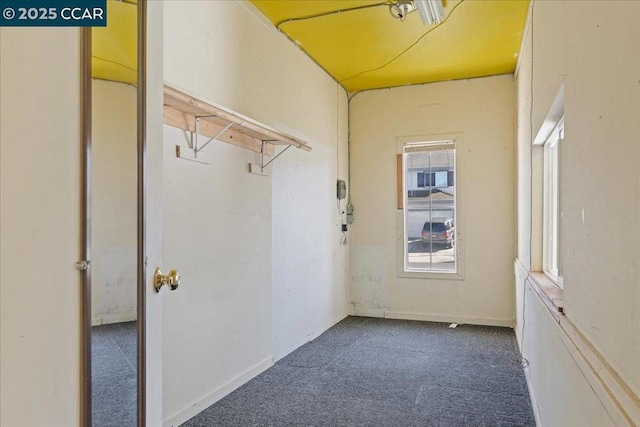 interior space featuring dark colored carpet