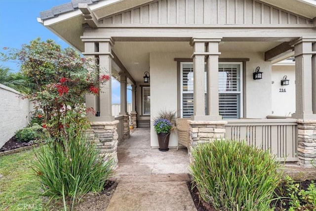 entrance to property featuring covered porch