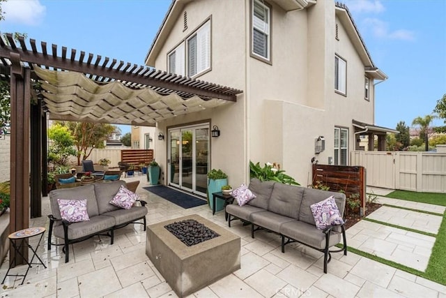 view of patio featuring a pergola and an outdoor living space with a fire pit