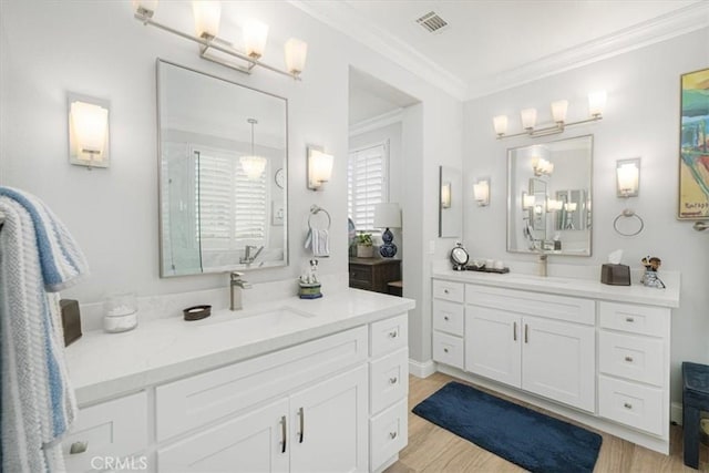 bathroom with vanity, walk in shower, crown molding, and wood-type flooring