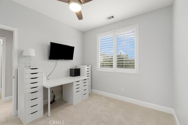 office featuring ceiling fan and light colored carpet