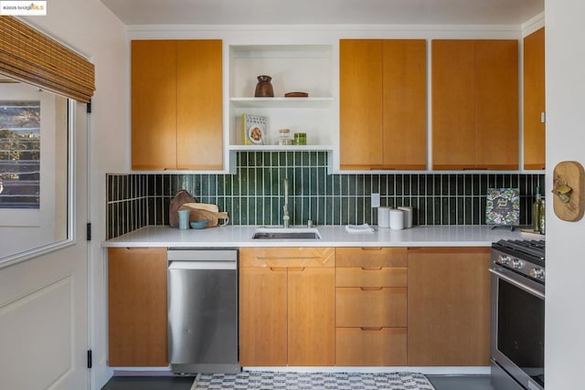 kitchen with tasteful backsplash, gas range, and sink