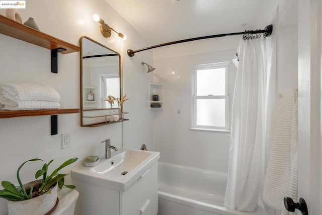 full bathroom featuring shower / bath combination with curtain, vanity, and toilet