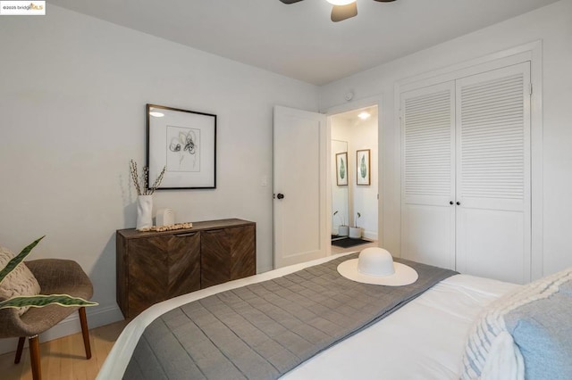 bedroom featuring wood-type flooring, a closet, and ceiling fan