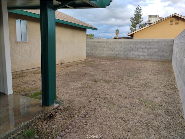 view of yard featuring central AC unit