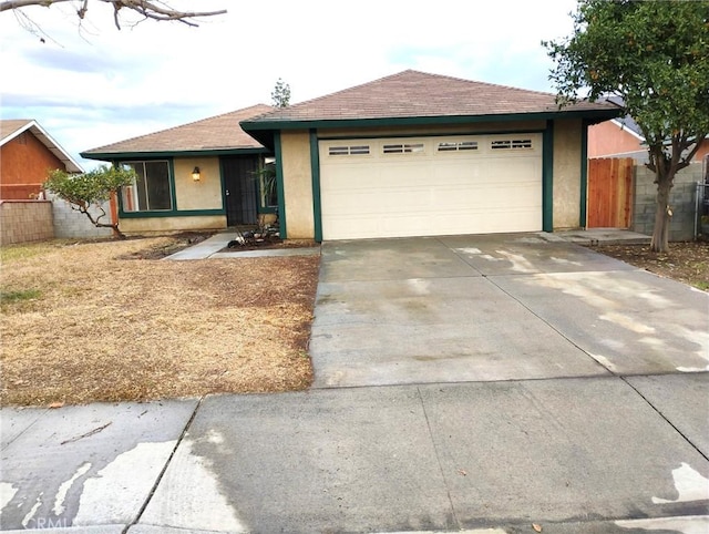 ranch-style home with a garage