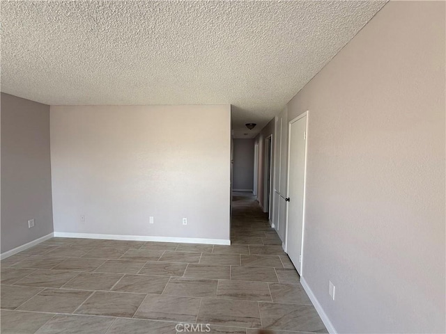 spare room featuring a textured ceiling