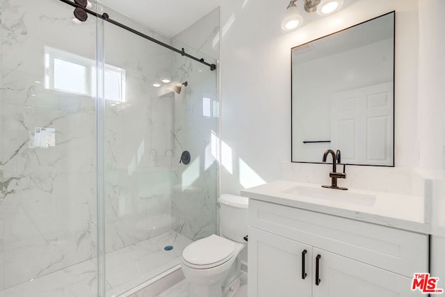 bathroom with walk in shower, vanity, and toilet