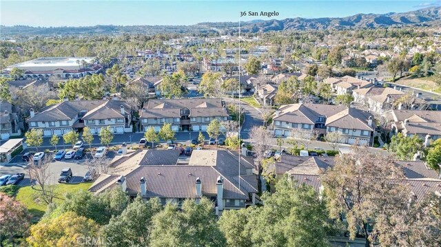 drone / aerial view featuring a mountain view