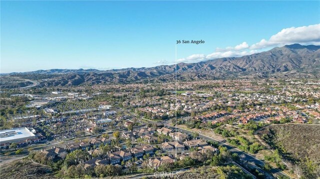 drone / aerial view featuring a mountain view