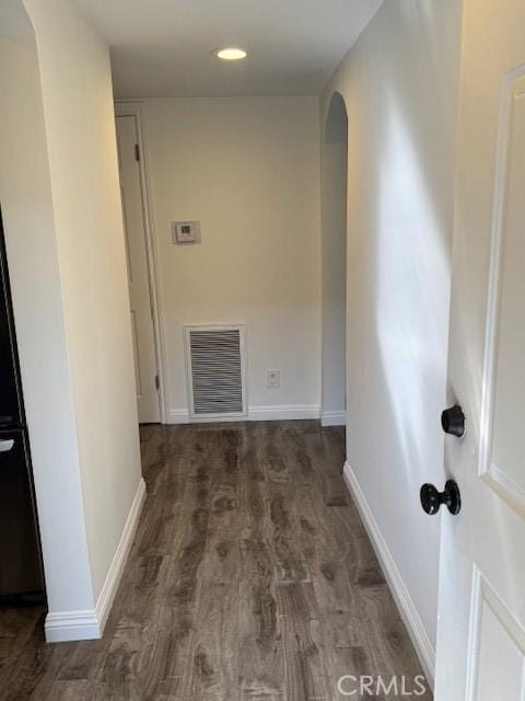 hall featuring dark wood-type flooring