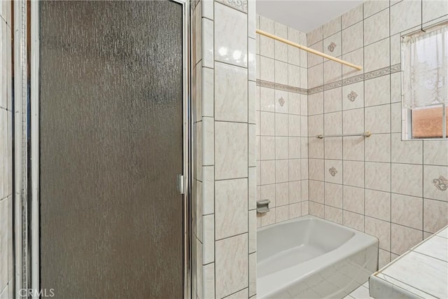 full bath featuring tile walls