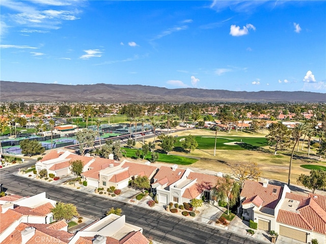 birds eye view of property with a mountain view