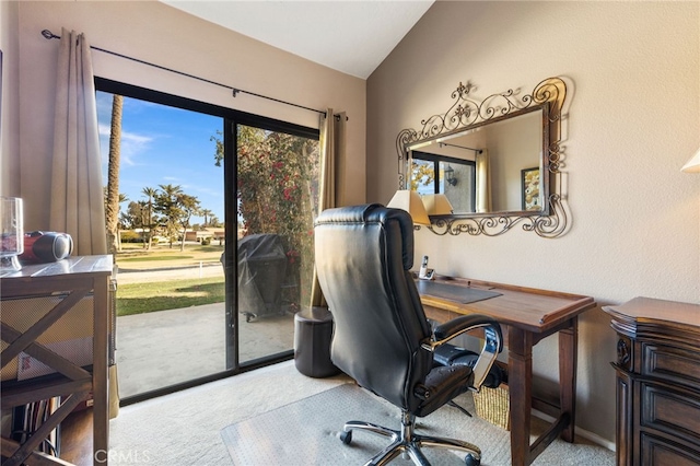 office featuring vaulted ceiling and carpet flooring