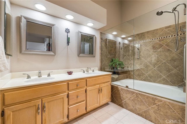 bathroom with vanity, tile patterned floors, and enclosed tub / shower combo