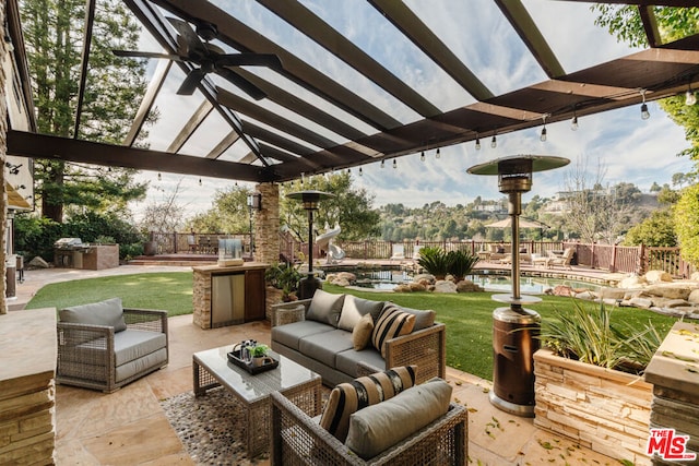 view of patio with a fenced in pool, ceiling fan, an outdoor hangout area, and a pergola