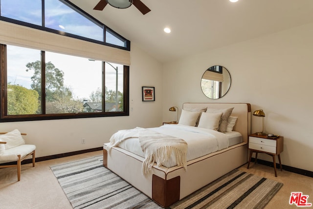 carpeted bedroom featuring high vaulted ceiling and ceiling fan