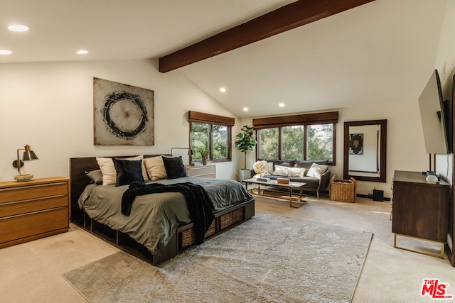 carpeted bedroom featuring lofted ceiling with beams