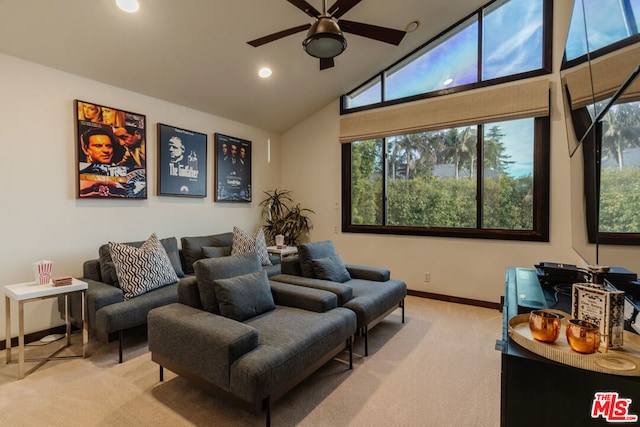 cinema room with light carpet, lofted ceiling, and ceiling fan