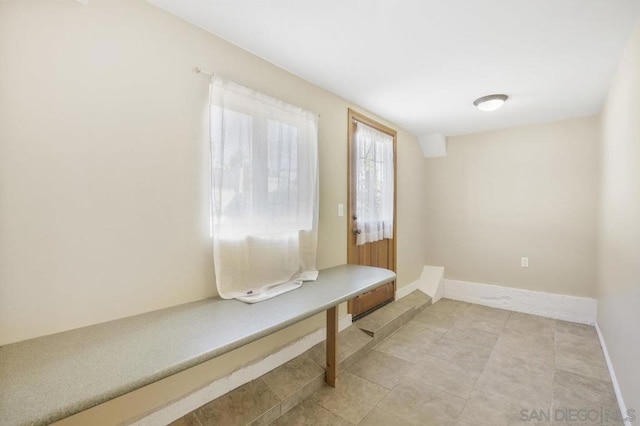 mudroom with light tile patterned floors