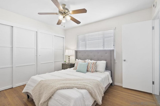 bedroom with ceiling fan and wood-type flooring