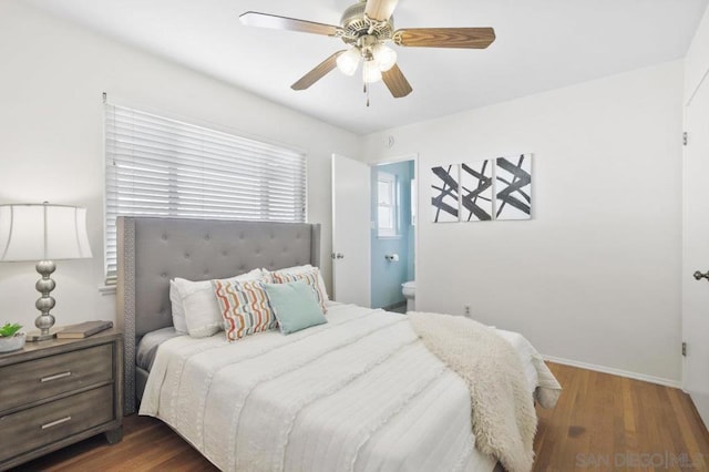 bedroom with ensuite bathroom, dark hardwood / wood-style floors, and ceiling fan