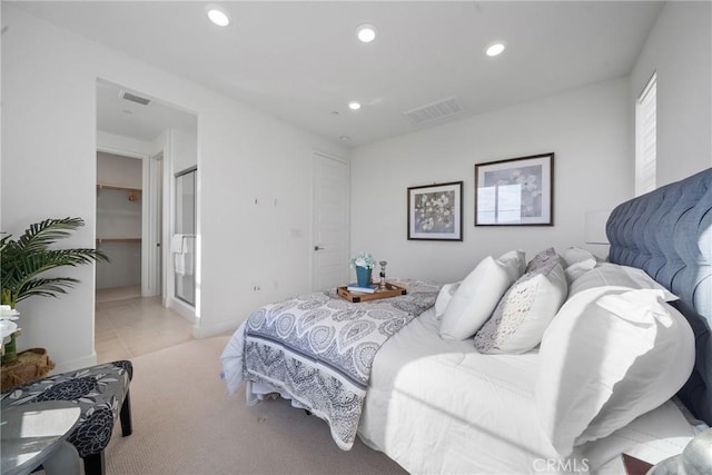 bedroom featuring light tile patterned flooring and a closet