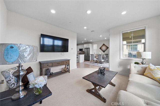 living room with light colored carpet