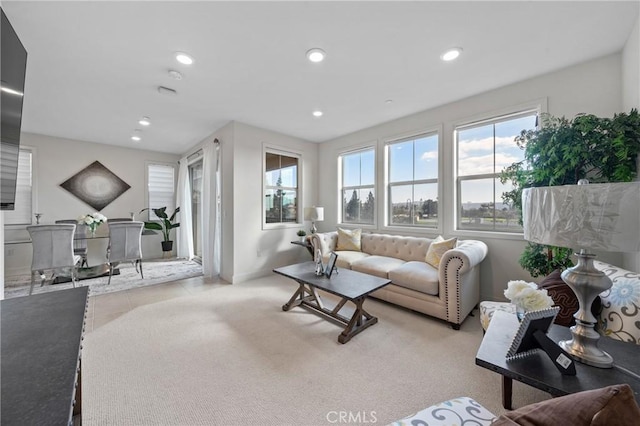 living room featuring light carpet