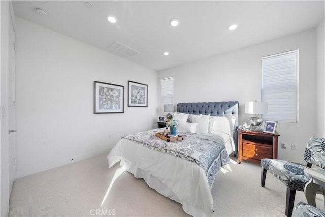 bedroom featuring light carpet