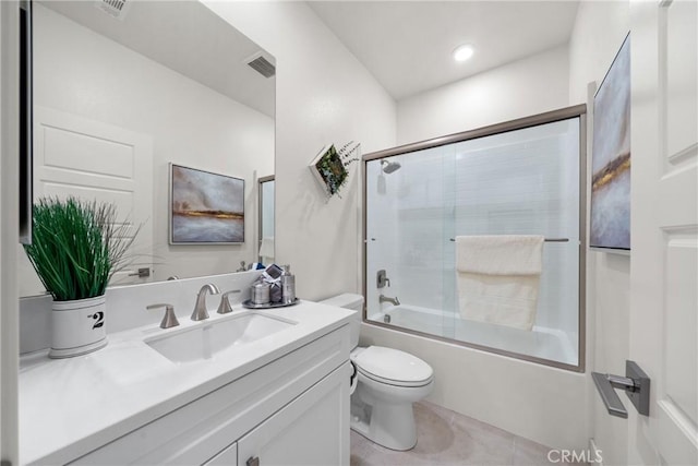 full bathroom featuring tile patterned floors, vanity, toilet, and combined bath / shower with glass door