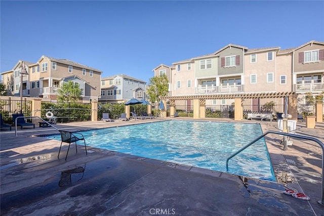 view of swimming pool with a patio area and a pergola