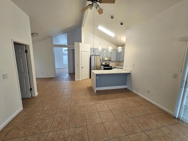 kitchen with light tile patterned floors, ceiling fan, appliances with stainless steel finishes, hanging light fixtures, and kitchen peninsula