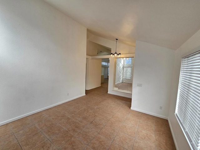 unfurnished living room with lofted ceiling, light tile patterned floors, plenty of natural light, and a chandelier