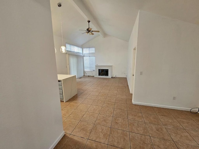 unfurnished living room with light tile patterned flooring, high vaulted ceiling, a fireplace, ceiling fan, and beam ceiling