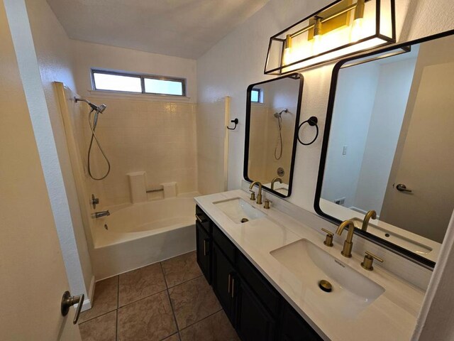 bathroom with tile patterned flooring, vanity, and shower / bathtub combination