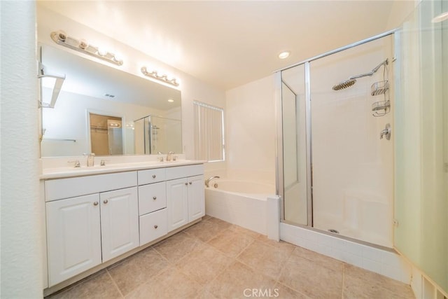 bathroom with vanity, tile patterned floors, and independent shower and bath