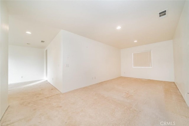 empty room featuring light colored carpet