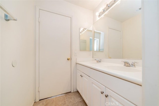 bathroom with tile patterned flooring and vanity